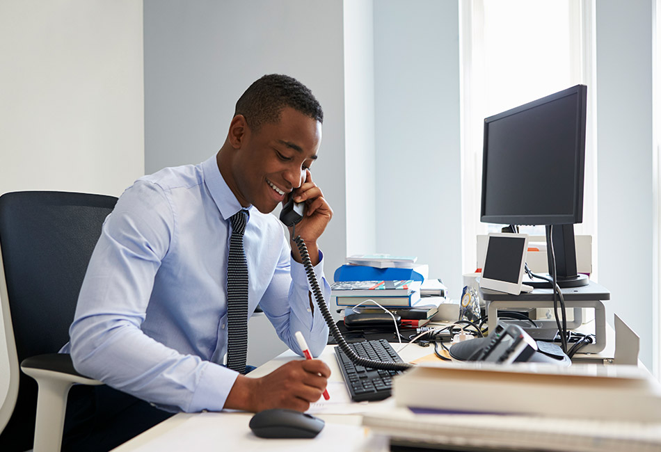 African American businessman on the phone at his desk