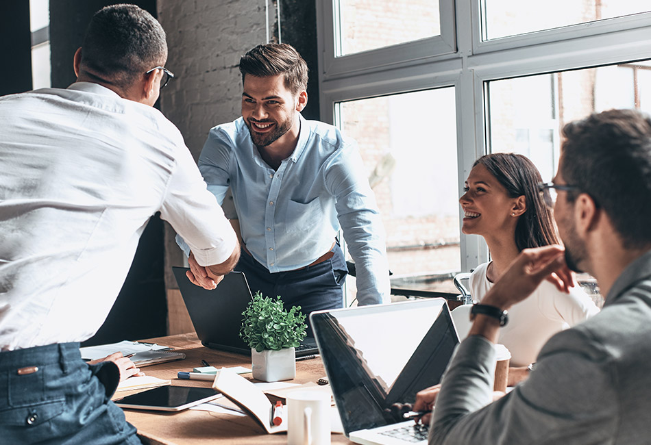 Group of people working around a table