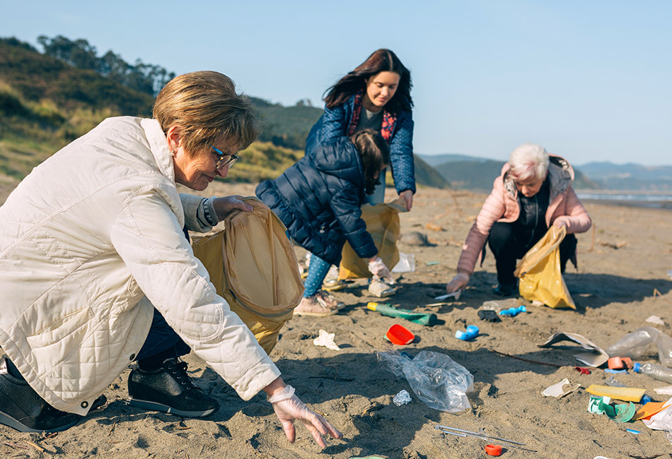 Women cleaning up beach