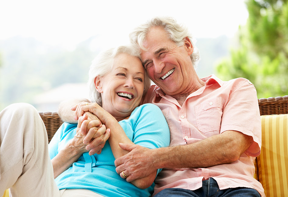 Older Caucasian couple hugging