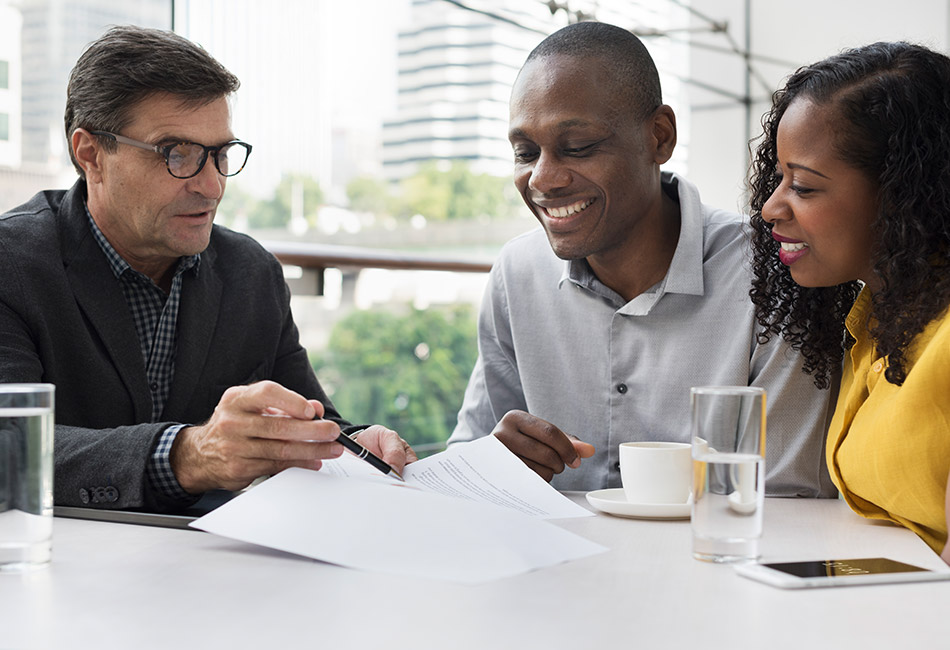 African American couple meeting with financial planner