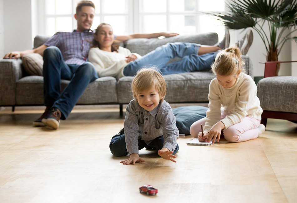 Kids playing on the floor at home