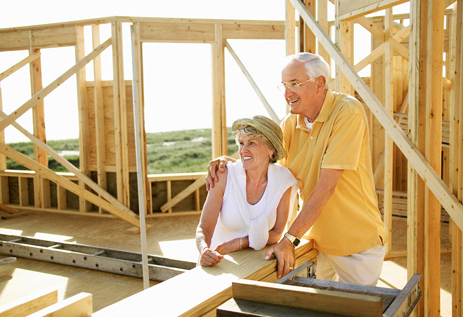 Older couple with home under construction