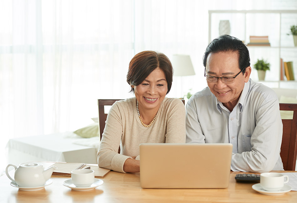 Asian couple at computer