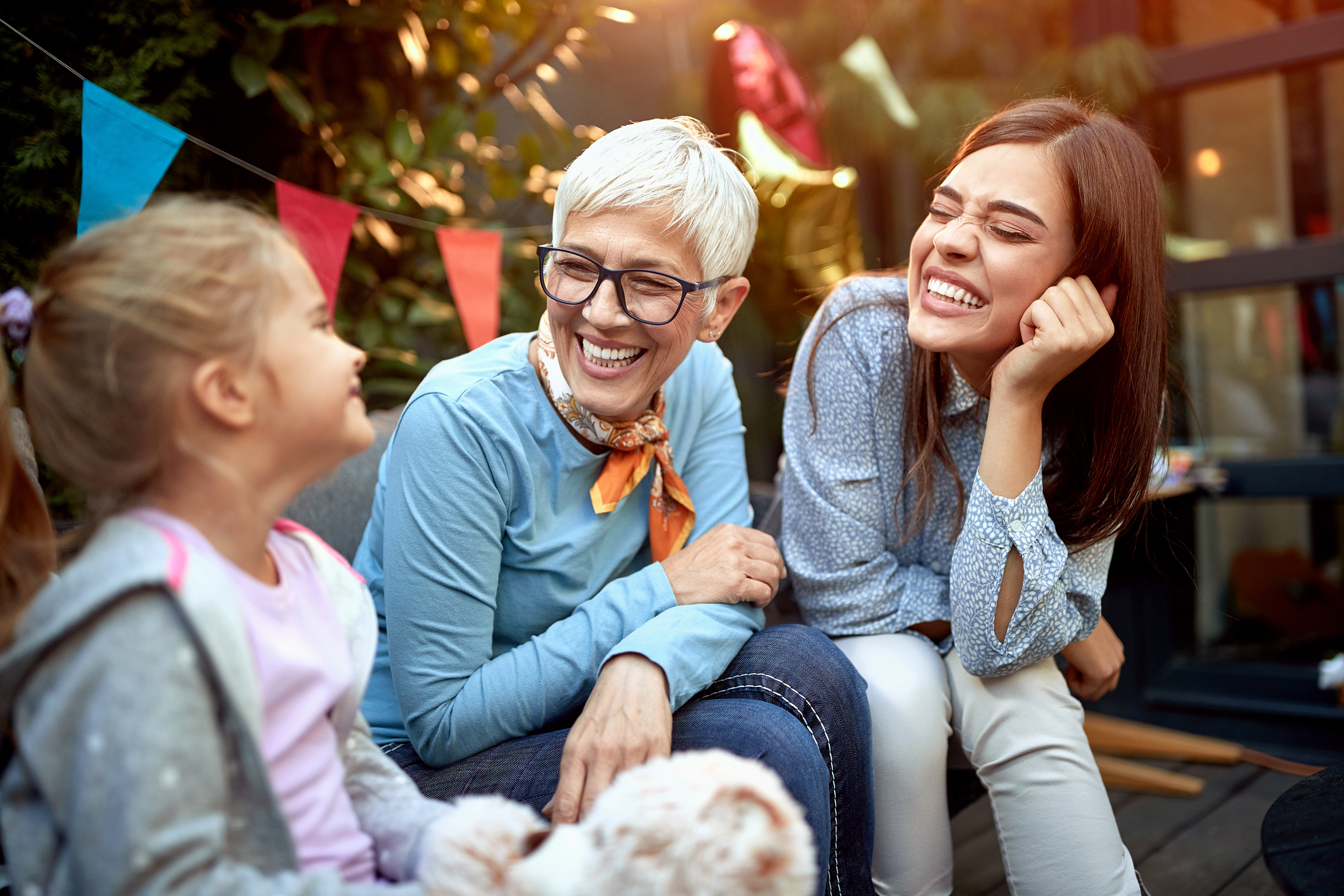 Grandma, daughter and granddaughter smiling