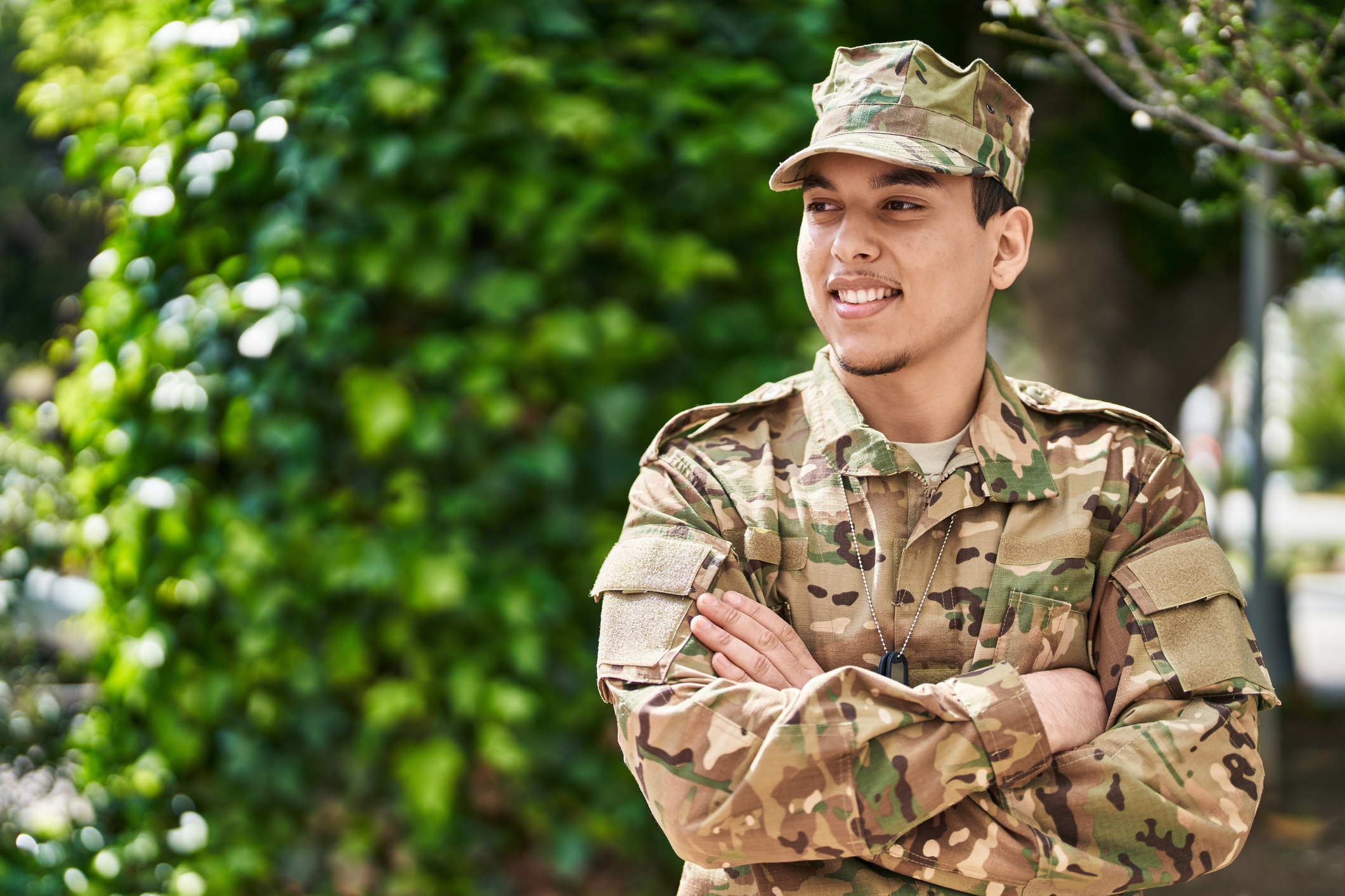military service member with arms folded
