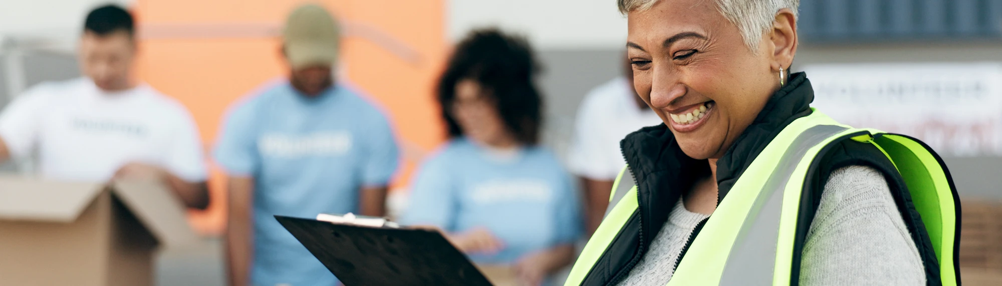 volunteer smiling with clipboard