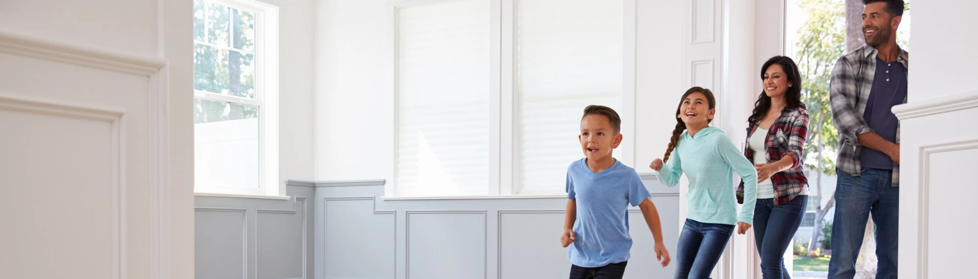 family running into new home