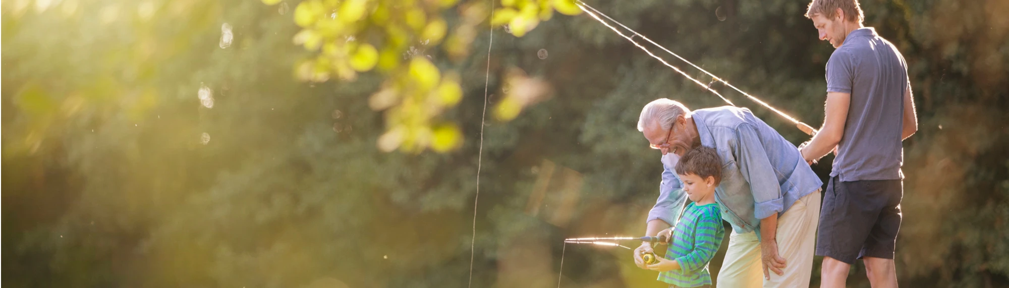 boy father and grandfather fishing