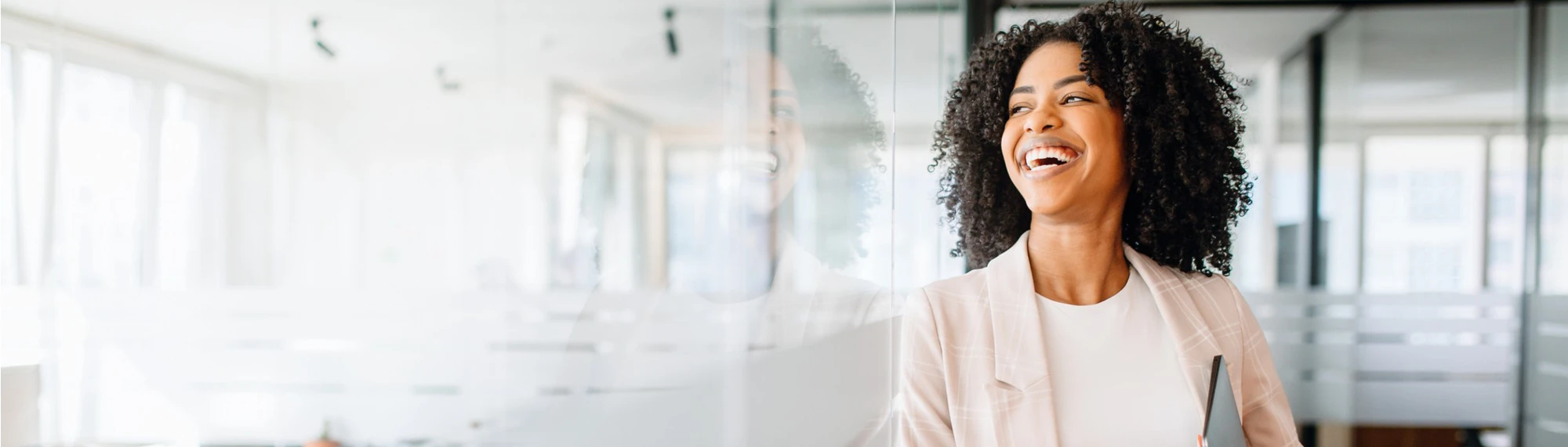 african american business woman standing in front of conference room