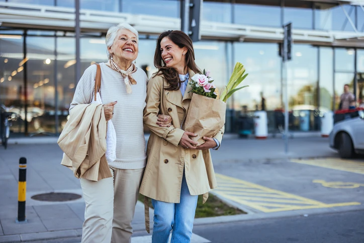 caucasian mom and daughter grocery shopping