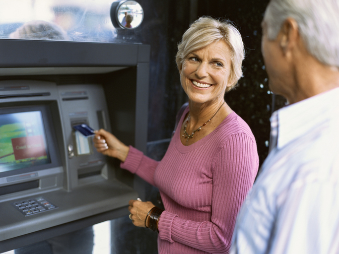 caucasian woman at atm