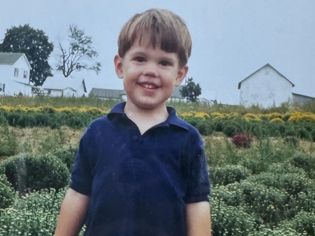 Kyle from Von Thun Farms in the dirt as a child