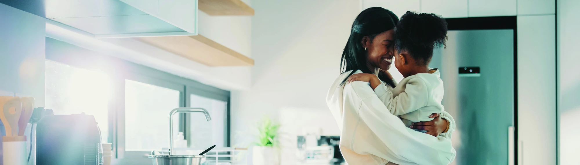 african american mom and daughter in kitchen