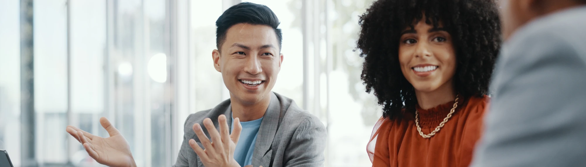 african american woman and asian man in a business meeting